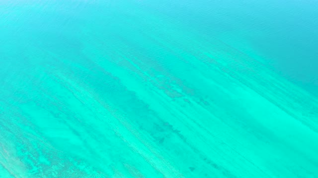 Clear Turquoise Water Over Sandy Ocean Floor