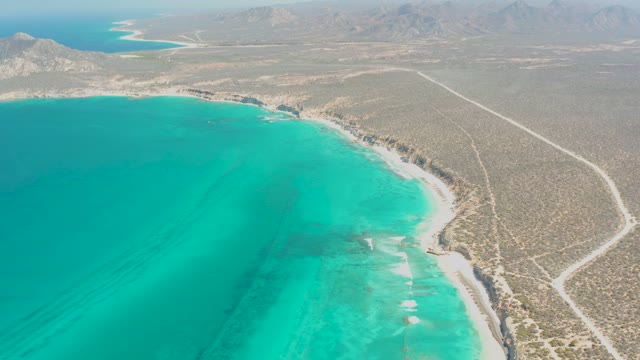Turquoise Ocean Meets Desert Shoreline