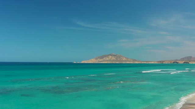 CABO PULMO BCS MEXICO-2021: Turquoise Ocean Waves Crashing on Sandy Shore