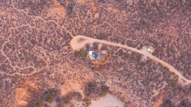 CABO PULMO BCS MEXICO-2021: A Person Walking near a Desert House