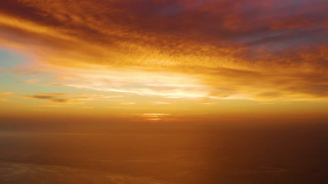 CABO PULMO BCS MEXICO-2021: Sunset over Calm Ocean with Colorful Clouds