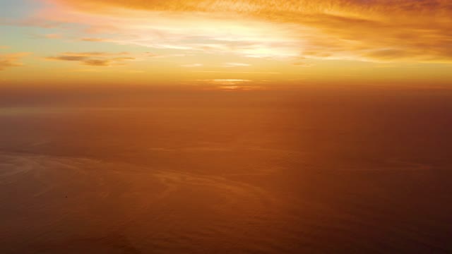 CABO PULMO BCS MEXICO-2021: Golden Sunset Over Calm Ocean Waters