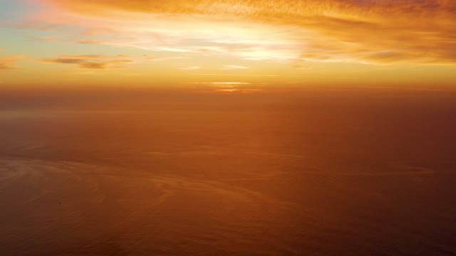CABO PULMO BCS MEXICO-2021: Golden Sunset over Calm Ocean Horizon