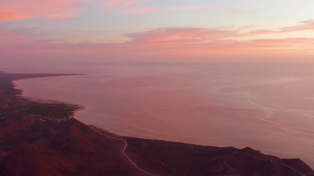 CABO PULMO BCS MEXICO-2021: Coastal Sunset Over Rugged Hills and Calm Sea