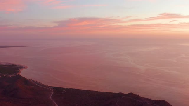 CABO PULMO BCS MEXICO-2021: Sunset Over Ocean and Coastal Hillside