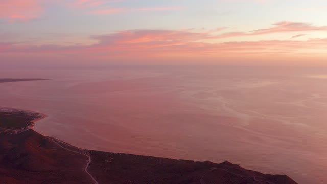 CABO PULMO BCS MEXICO-2021: Coastal Sunset and Moving Car on Hillside Road