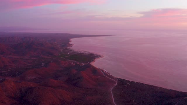 CABO PULMO BCS MEXICO-2021: Red Rock Coastline at Sunset with Ocean