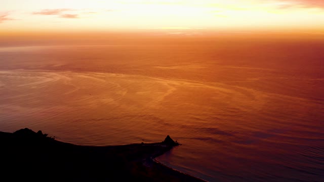 CABO PULMO BCS MEXICO-2021: Coastal Sunset with Calm Ocean and Cliff