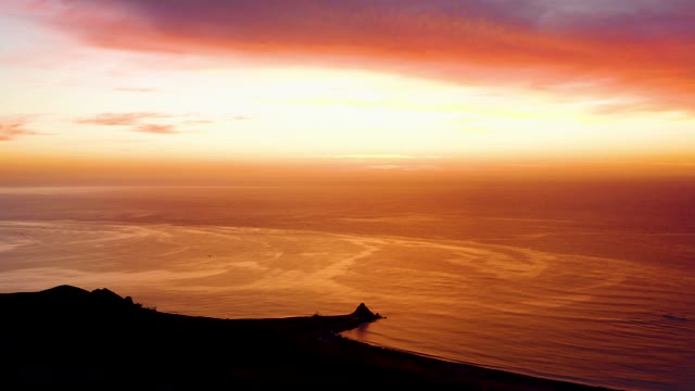 CABO PULMO BCS MEXICO-2021: Coastal Sunset with Golden Ocean and Dark Cliffs