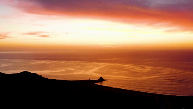 CABO PULMO BCS MEXICO-2021: Sunset Over Ocean with Silhouetted Coastline