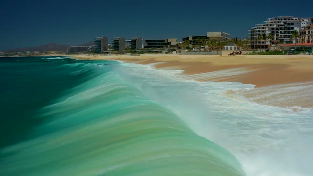 MARQUIS LOS CABOS BCS MEXICO-2021: Ocean Wave Crashing and Receding on Sandy Beach
