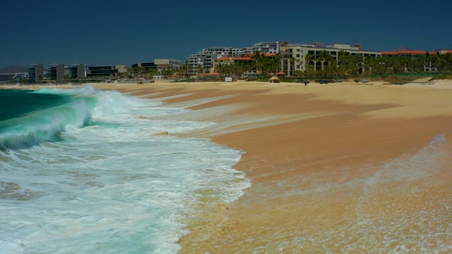 MARQUIS LOS CABOS BCS MEXICO-2021: Waves Crashing Onto Sandy Beach Shoreline