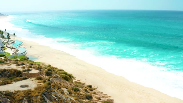 MARQUIS LOS CABOS BCS MEXICO-2021: Ocean Wave Breaking on Sandy Beach From Cliff