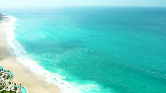 MARQUIS LOS CABOS BCS MEXICO-2021: Gentle Ocean Waves Rolling Onto Sandy Beach From Above