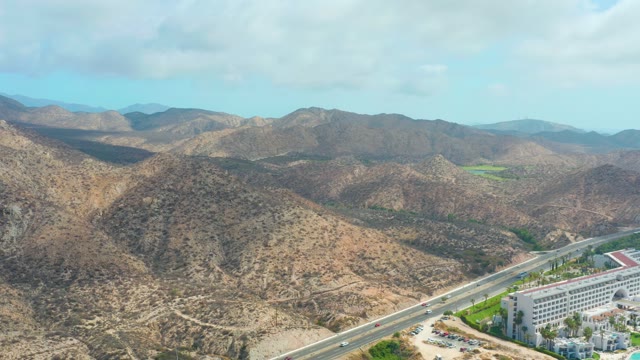MARQUIS LOS CABOS BCS MEXICO-2021: Highway Through Mountainous Terrain with Building