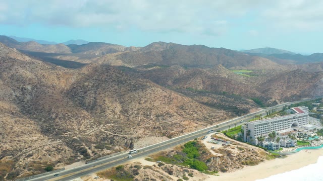 MARQUIS LOS CABOS BCS MEXICO-2021: Coastal Highway with Mountain Backdrop and Beach