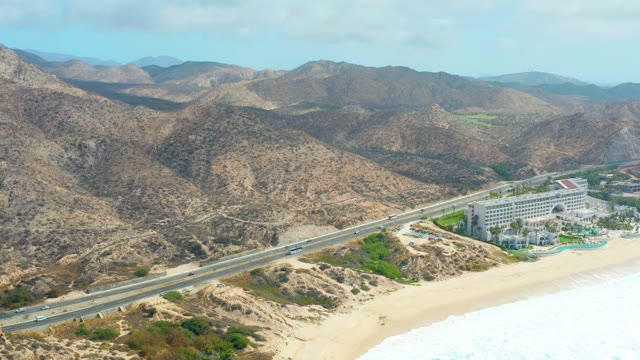 MARQUIS LOS CABOS BCS MEXICO-2021: Coastal Highway with Traffic and Mountain Backdrop