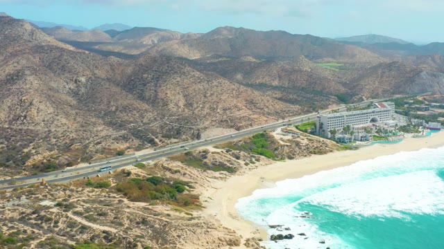 MARQUIS LOS CABOS BCS MEXICO-2021: Car Driving Along Coastal Highway near Sandy Beach