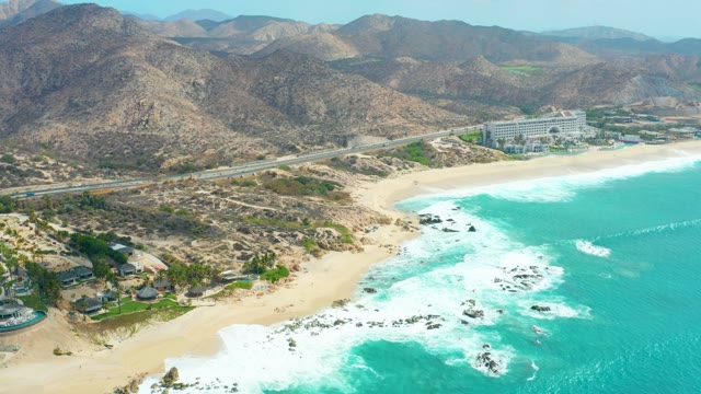 MARQUIS LOS CABOS BCS MEXICO-2021: Ocean Waves Crashing on Rocky Shore Aerial