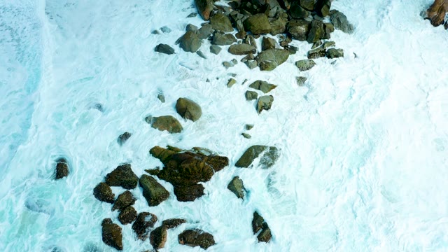MARQUIS LOS CABOS BCS MEXICO-2021: Waves Receding From Rocky Shore, Exposing Sandy Beach