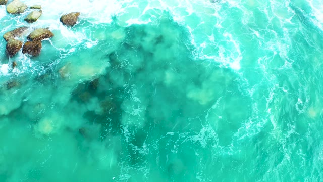 MARQUIS LOS CABOS BCS MEXICO-2021: Waves Crashing Against Rocky Shoreline in Turquoise Ocean