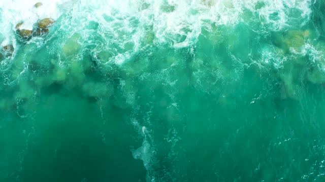 MARQUIS LOS CABOS BCS MEXICO-2021: Turquoise Ocean Waves Receding to Reveal Rocky Seabed