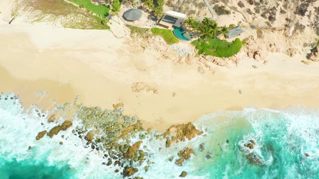 MARQUIS LOS CABOS BCS MEXICO-2021: Waves Crashing on Rocky Shore with Beach House