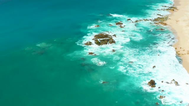 MARQUIS LOS CABOS BCS MEXICO-2021: Waves Crashing on Rocky Shoreline From Aerial View