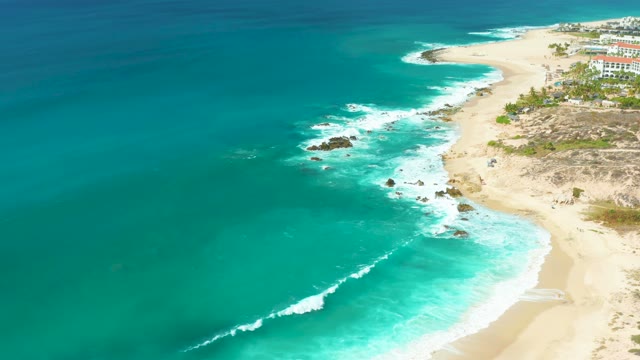 MARQUIS LOS CABOS BCS MEXICO-2021: Waves Crashing on Rocky Shoreline with Sandy Beach