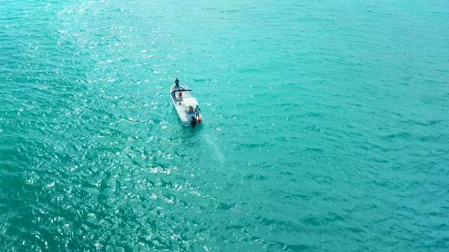 MARQUIS LOS CABOS BCS MEXICO-2021: Small Motorboat Moving Through Calm Turquoise Waters