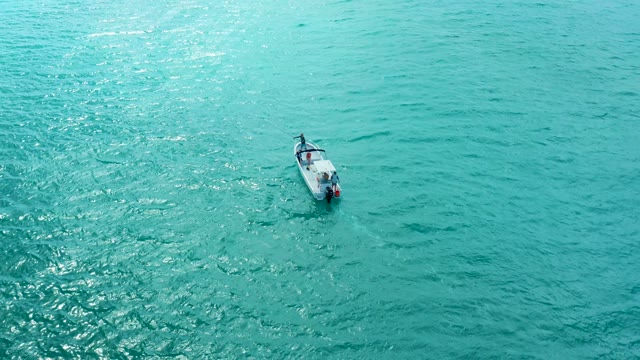 MARQUIS LOS CABOS BCS MEXICO-2021: Small Boat Moving on Calm Turquoise Waters