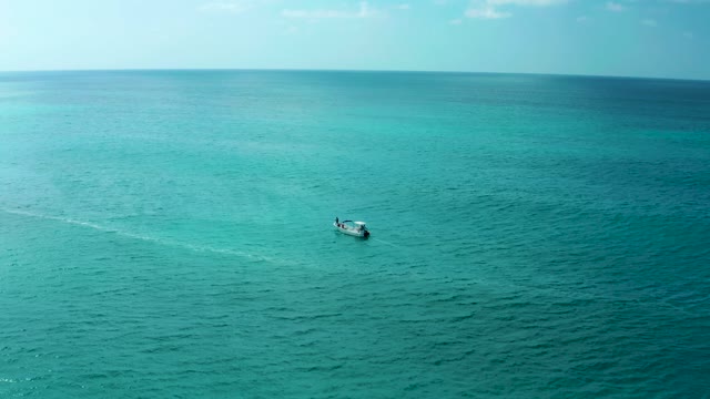 MARQUIS LOS CABOS BCS MEXICO-2021: Boat Cruising Across Turquoise Ocean Waters