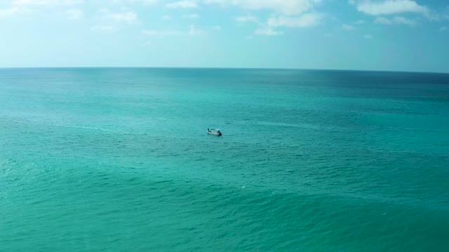MARQUIS LOS CABOS BCS MEXICO-2021: Small Boat Moving Across Turquoise Ocean