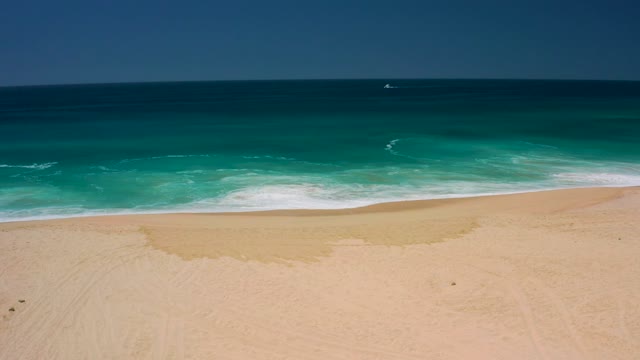 DREAMS LOS CABOS BCS MEXICO-2021: Gentle Ocean Waves Receding From Sandy Shore