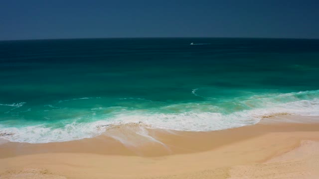 DREAMS LOS CABOS BCS MEXICO-2021: Waves Rolling Onto Sandy Beach From Above