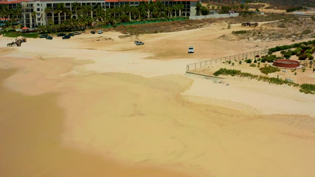 DREAMS LOS CABOS BCS MEXICO-2021: Beach Construction Site with Parked Vehicles