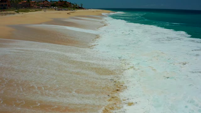 DREAMS LOS CABOS BCS MEXICO-2021: Waves Receding on Sandy Beach Shore