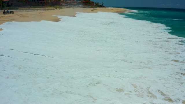 DREAMS LOS CABOS BCS MEXICO-2021: Waves Advancing over Sandy Beach