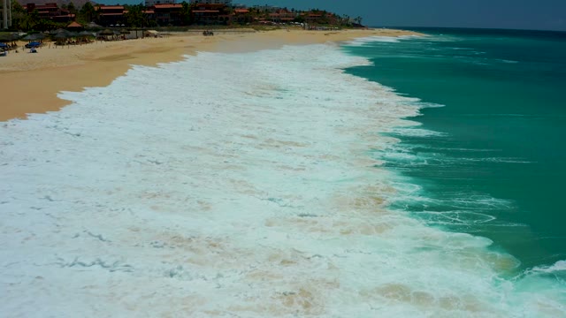 DREAMS LOS CABOS BCS MEXICO-2021: Waves Advancing on a Sandy Beach