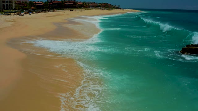 DREAMS LOS CABOS BCS MEXICO-2021: Waves Crashing Onto Sandy Shore