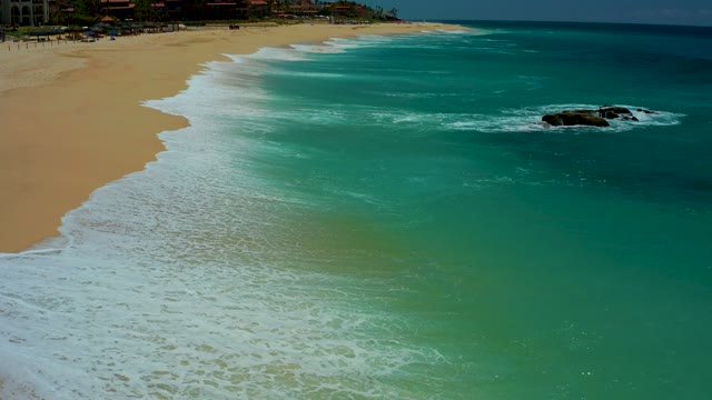 DREAMS LOS CABOS BCS MEXICO-2021: Waves Rolling Onto Sandy Beach