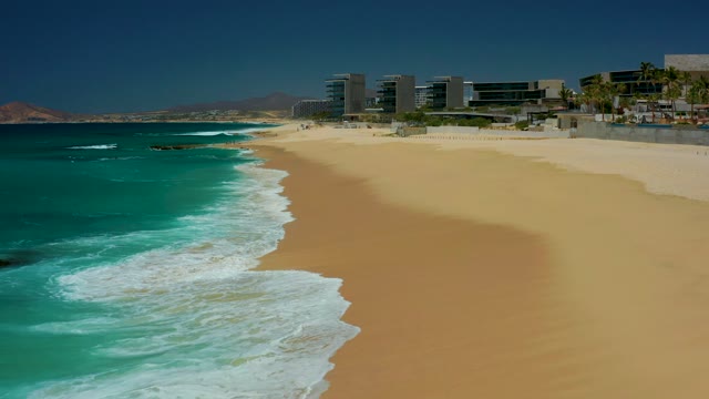 DREAMS LOS CABOS BCS MEXICO-2021: Gentle Ocean Waves Lapping at Sandy Shoreline