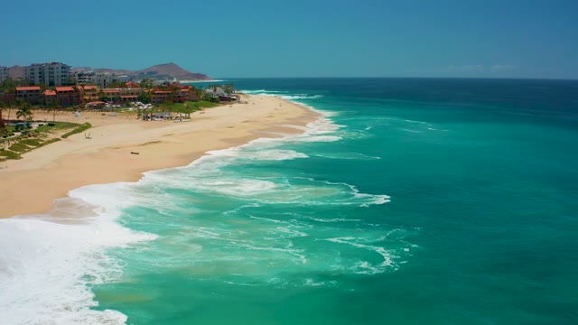 DREAMS LOS CABOS BCS MEXICO-2021: Gentle Ocean Waves Rolling Onto Sandy Shore