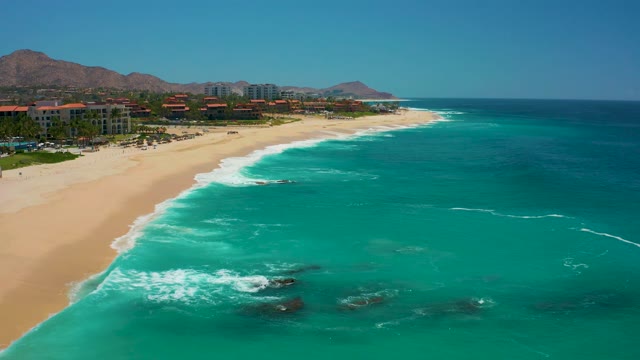 DREAMS LOS CABOS BCS MEXICO-2021: Waves Breaking on Sandy Beach Shoreline