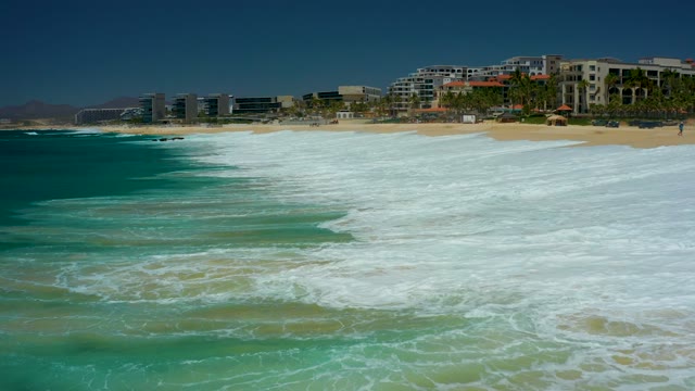DREAMS LOS CABOS BCS MEXICO-2021: Ocean Waves Crashing on Sandy Shore