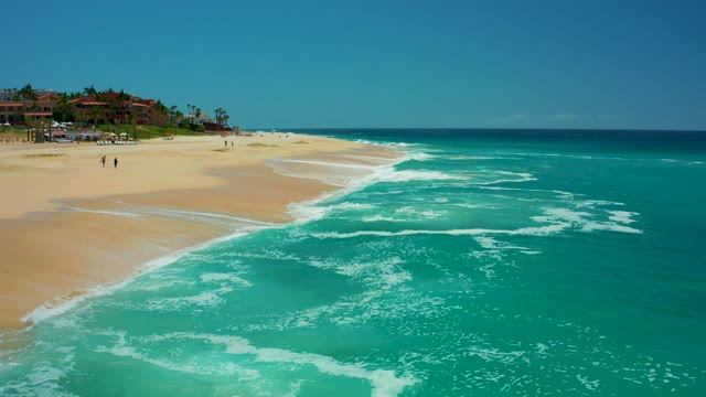 DREAMS LOS CABOS BCS MEXICO-2021: Waves Rolling Onto Sandy Beach