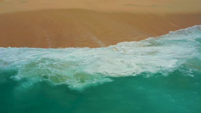 DREAMS LOS CABOS BCS MEXICO-2021: Waves Rolling Onto a Sandy Beach