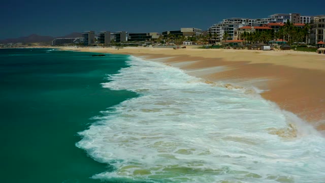 DREAMS LOS CABOS BCS MEXICO-2021: Waves Rolling Onto Sandy Beach