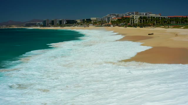 DREAMS LOS CABOS BCS MEXICO-2021: Waves Crashing on Sandy Shore