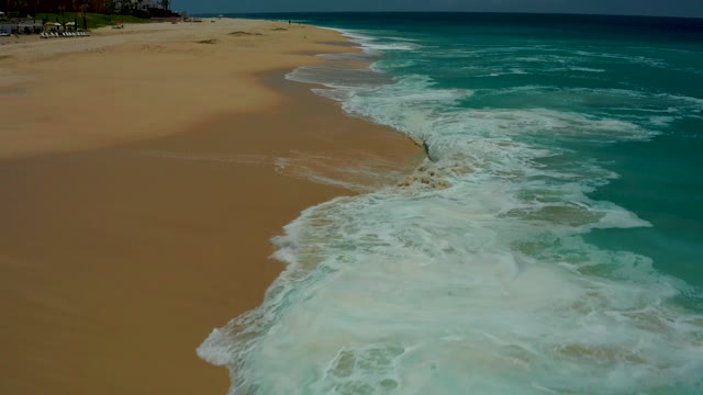 DREAMS LOS CABOS BCS MEXICO-2021: Ocean Waves Crashing on Sandy Beach